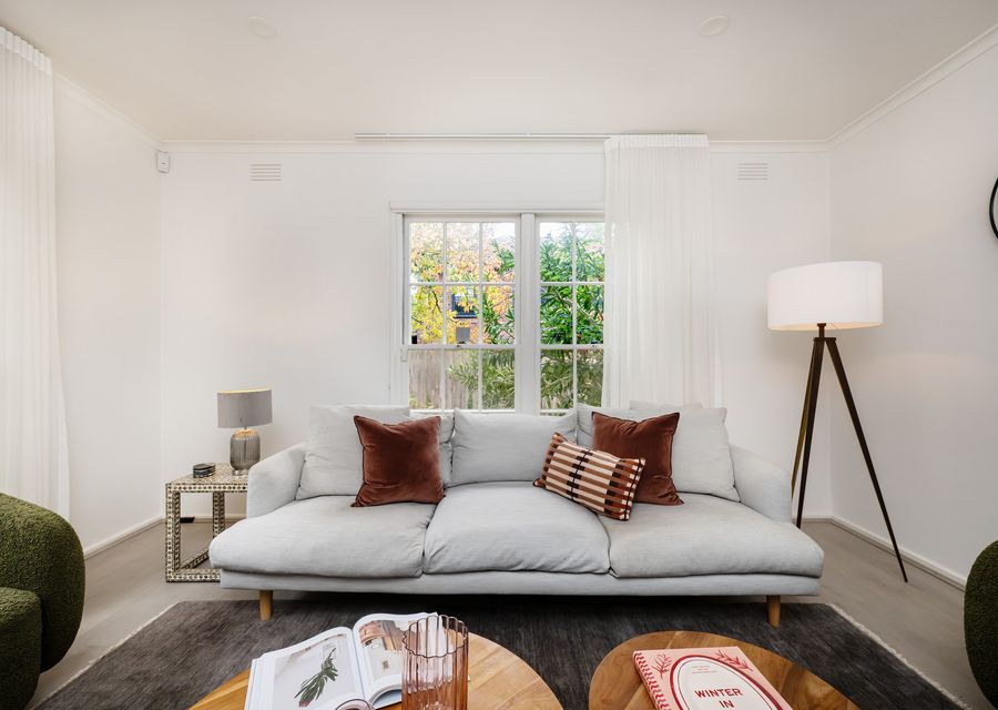 Spacious living room with plenty of seating for family and friends.