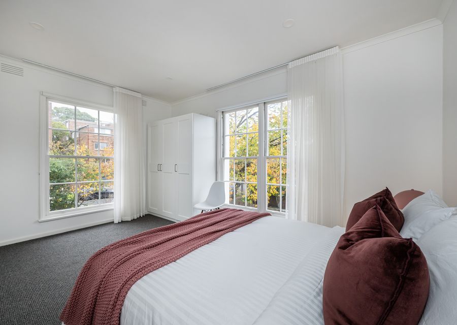 Light-filled bedroom with garden views.