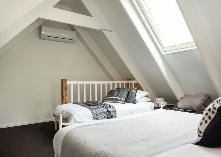 Welcome to our bedroom that features a queen size bed and single bed.