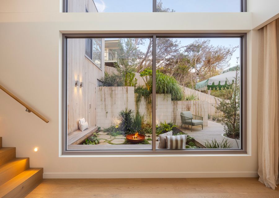 Soaring Ceilings and Windows overlooking Firepit area