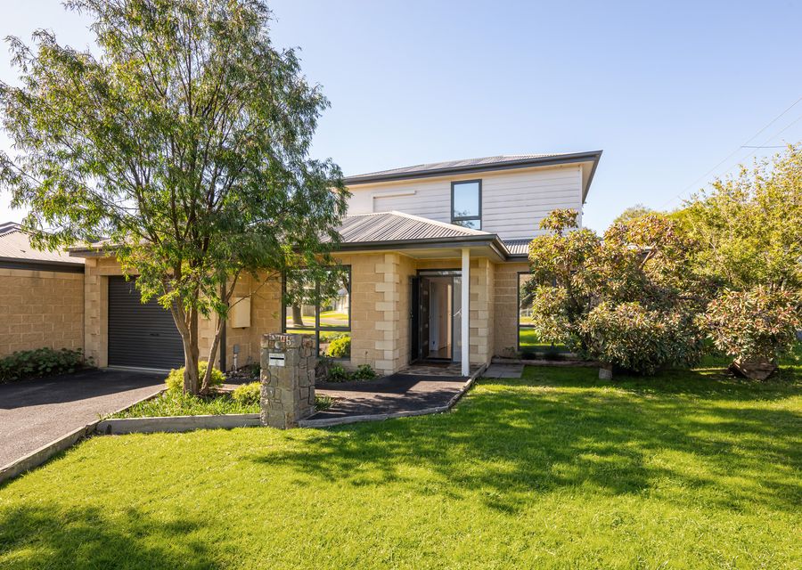 Spacious front yard with plenty of room for children to play and run around.
