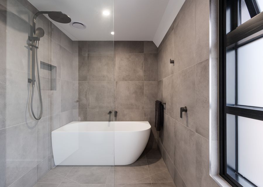 Bathroom with bathtub and shower