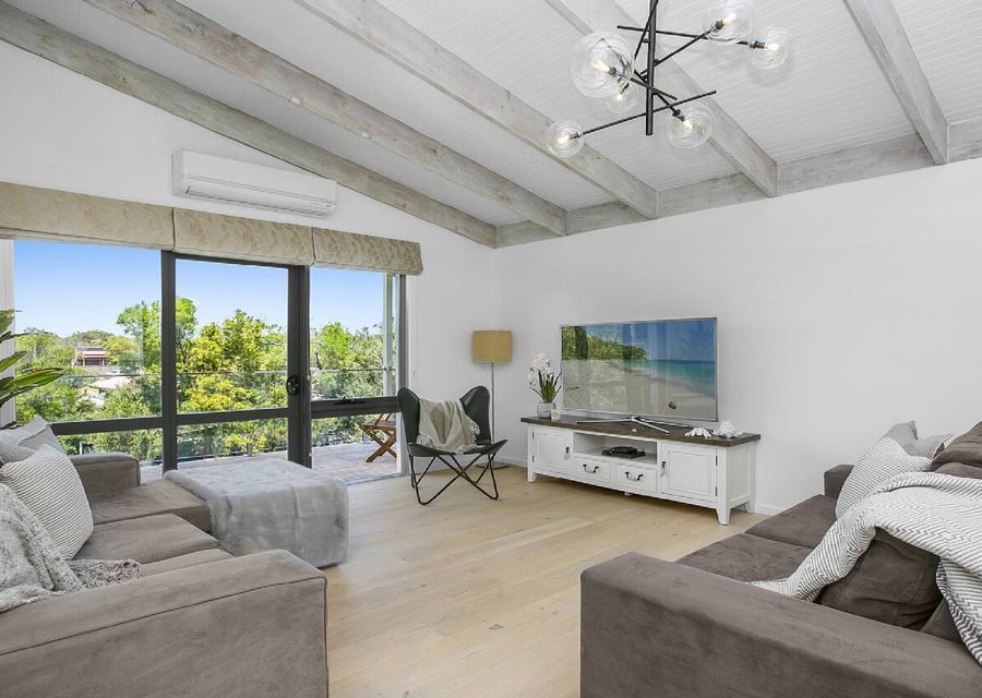 Step into our elegant living room with a big TV, perfect for gathering with your love ones.