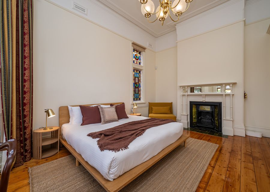 Beautiful bedroom with decorative fireplace