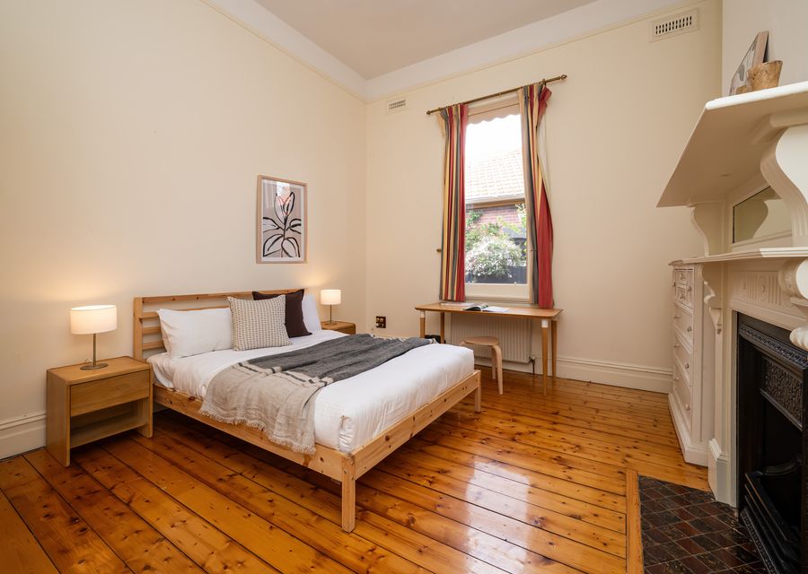 Comfortable bedroom with timber floors