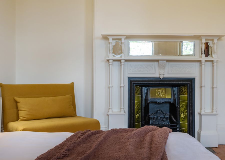 Charming decorative fireplace and reading nook