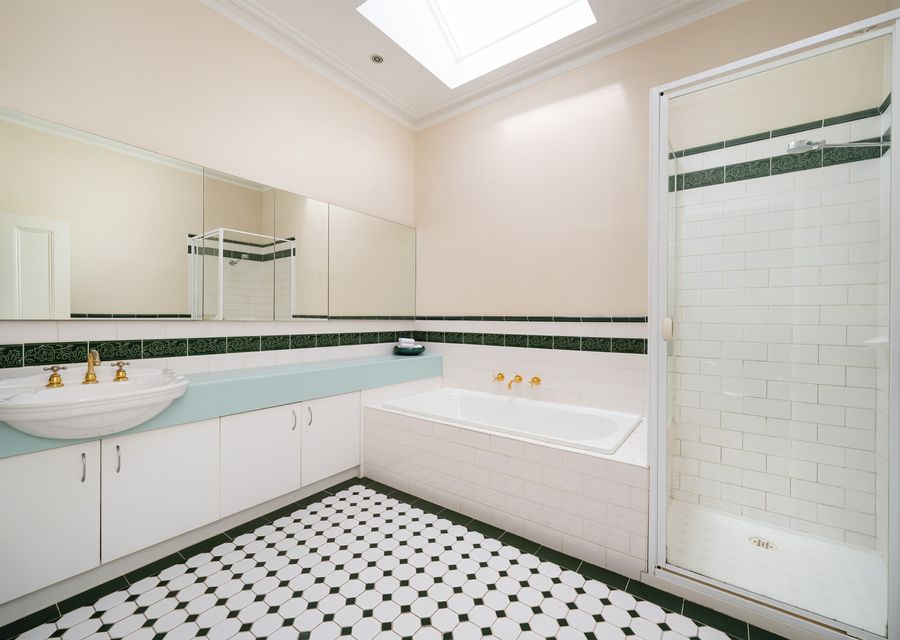 Bright bathroom with bathtub and shower
