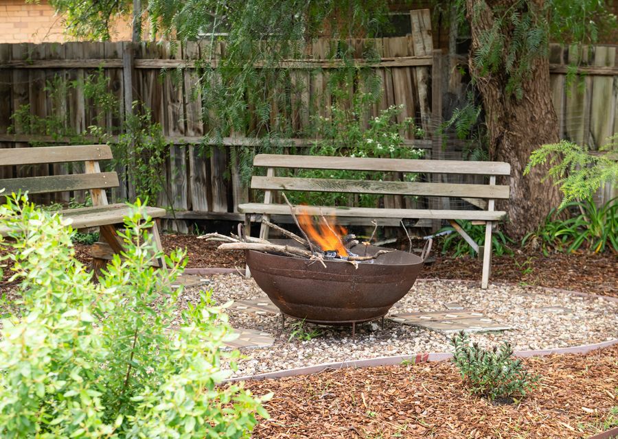 Peaceful outdoor fire pit with garden seating