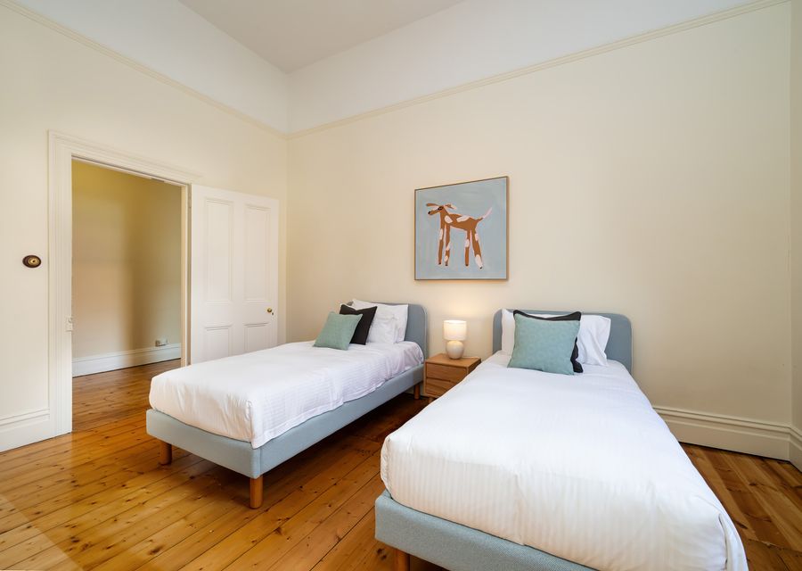 Cosy twin bedroom with bedside table