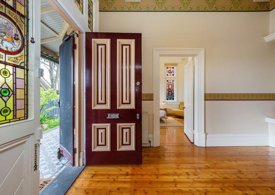 Welcoming entrance with stained-glass windows