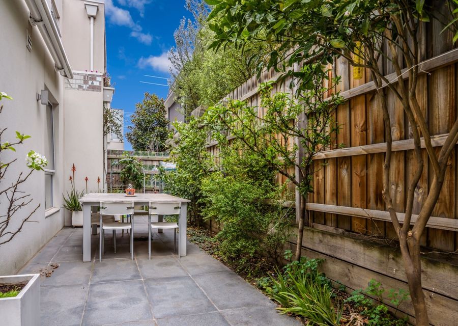Outdoor table and chairs in private courtyard, seats 4