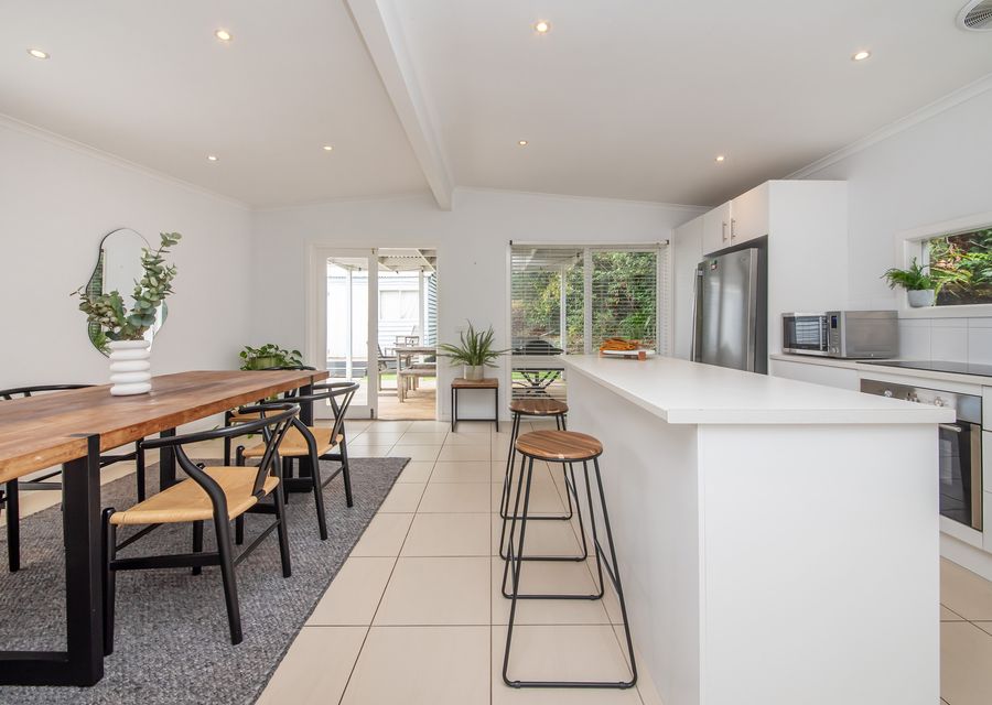 Fully equipped kitchen and dining area with seating for 5