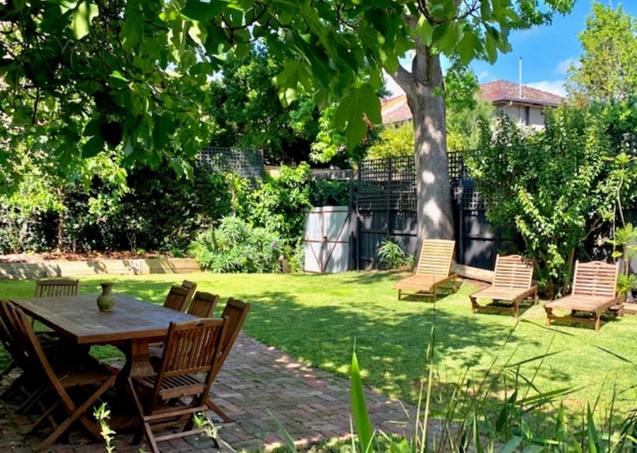 Spacious, sunny garden with outdoor seating