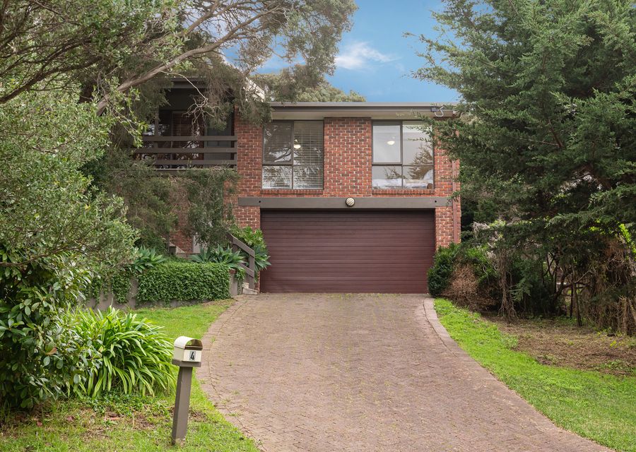 Exterior view surrounded by lush greenery.