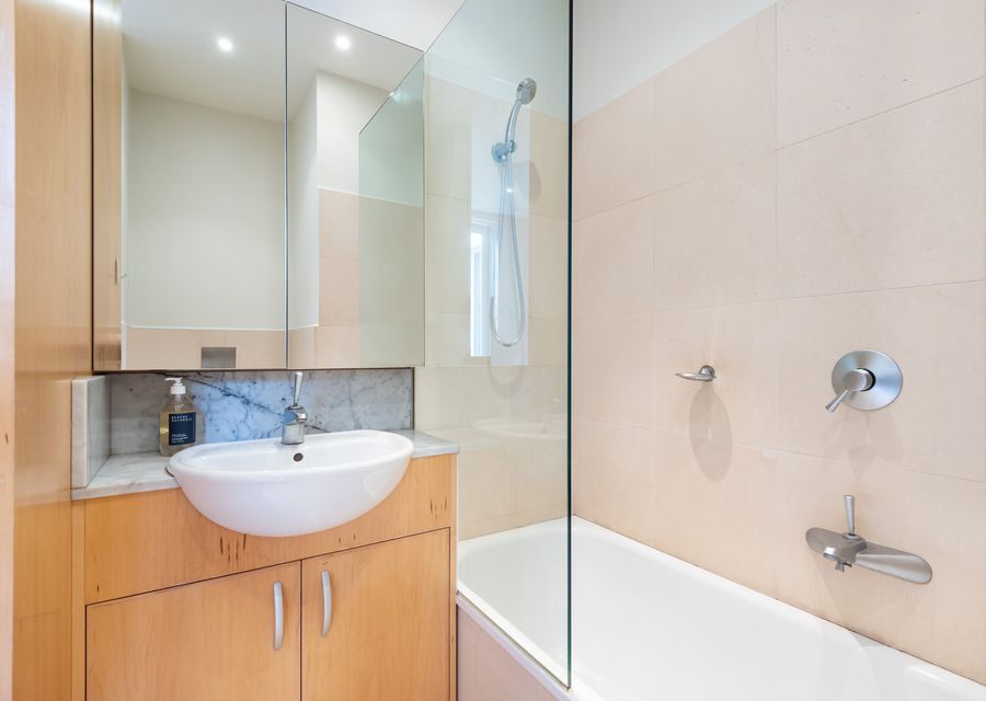 Family bathroom with shower over bath