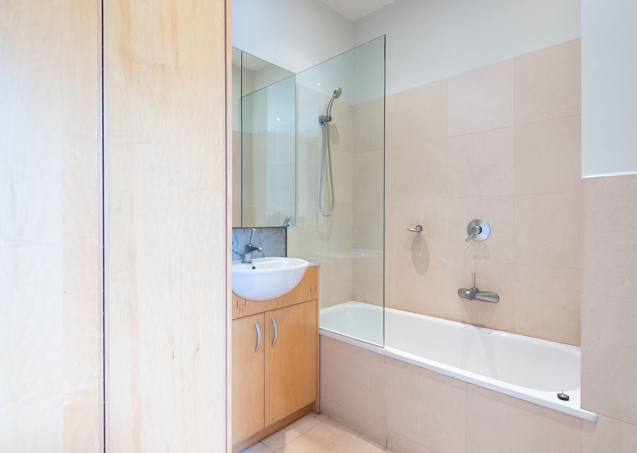 Family bathroom with shower over bath