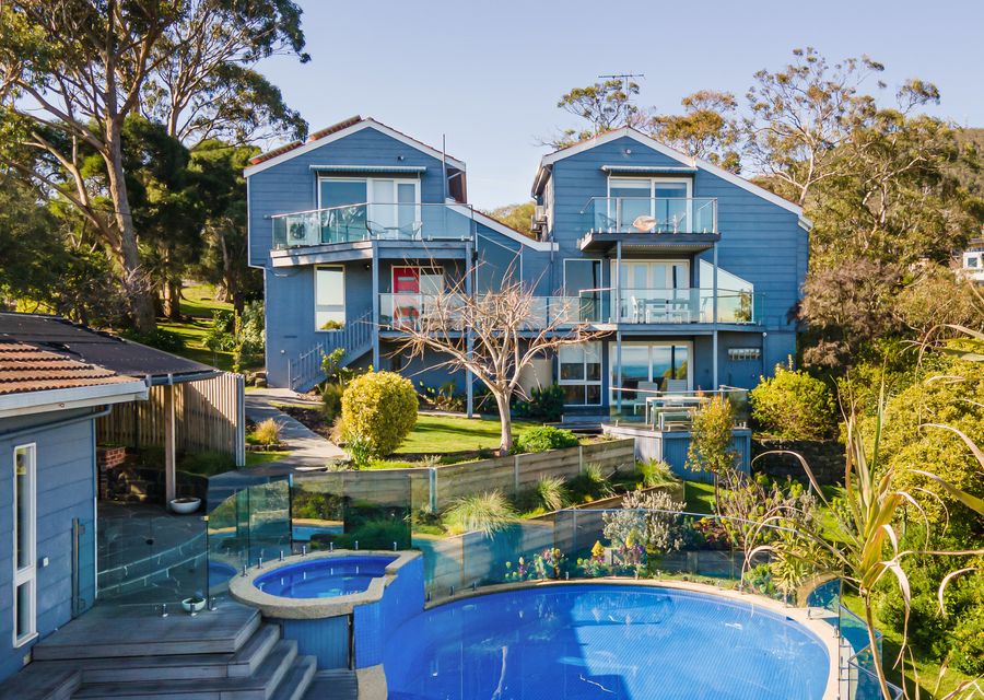 Breathtaking is the view of our house exterior, complete with a sparkling pool and inviting spa. Here, charm and elegance converge amidst picturesque surroundings.