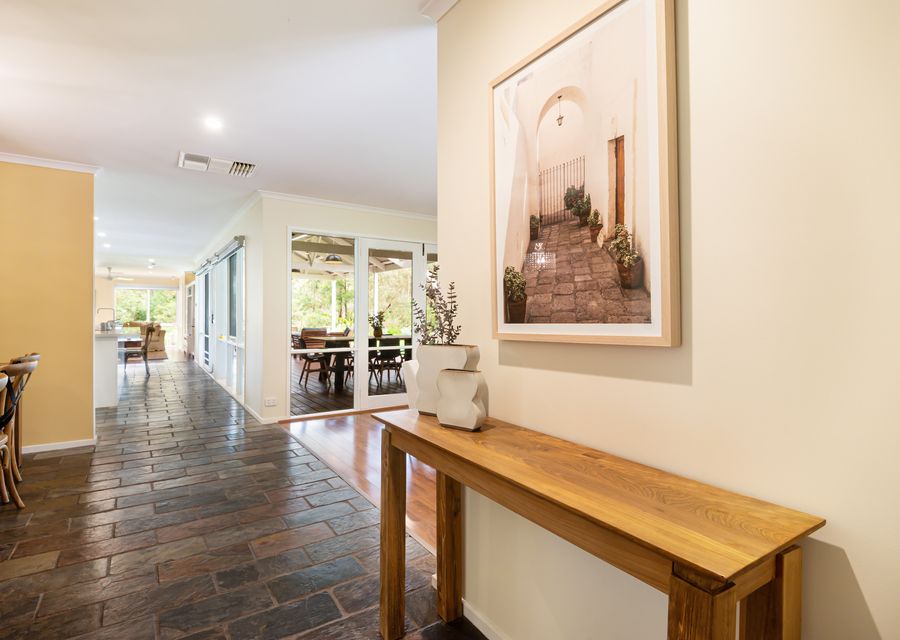 Step into the elegant hallway, where a sense of warmth and sophistication greets you immediately. 