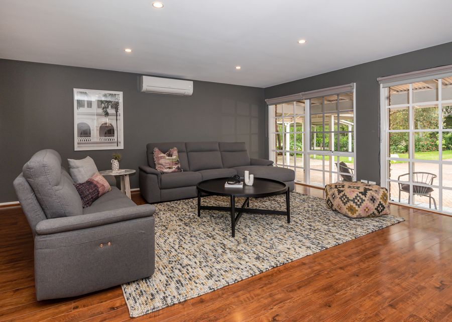 third living with TV and open fireplace