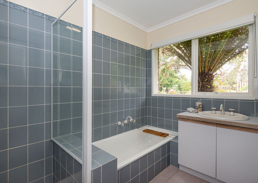 Bathroom with bath and shower 