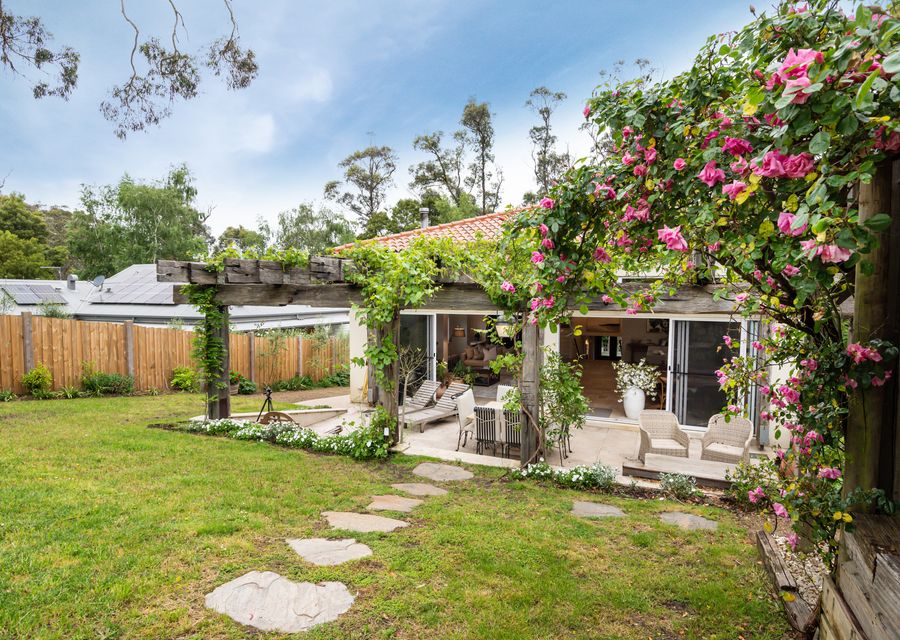 Enjoy the outdoor view of our lovely house, surrounded by lush greenery.