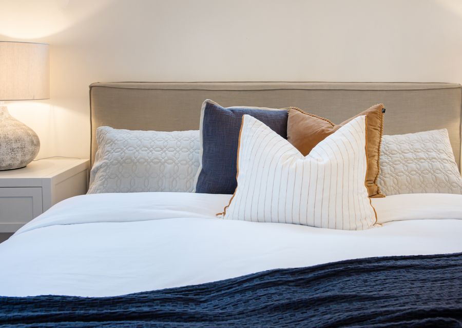Enjoy the soft, high-quality king size bed with luxurious linens and plump pillows.