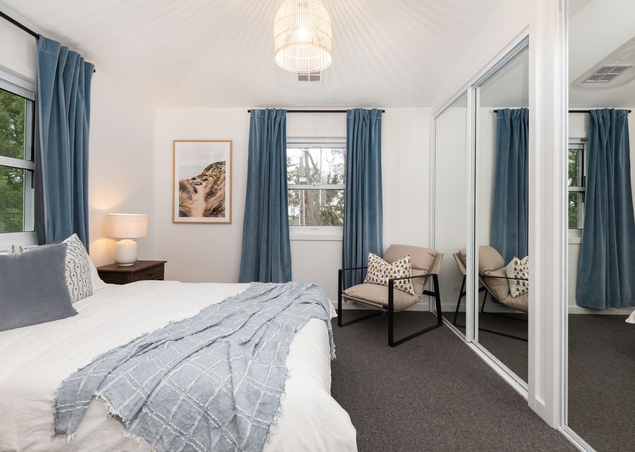 Welcome to our spacious bedroom, featuring our queen size bed.