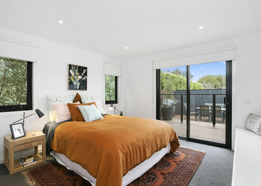Fourth bedroom with queen bed and bathroom.