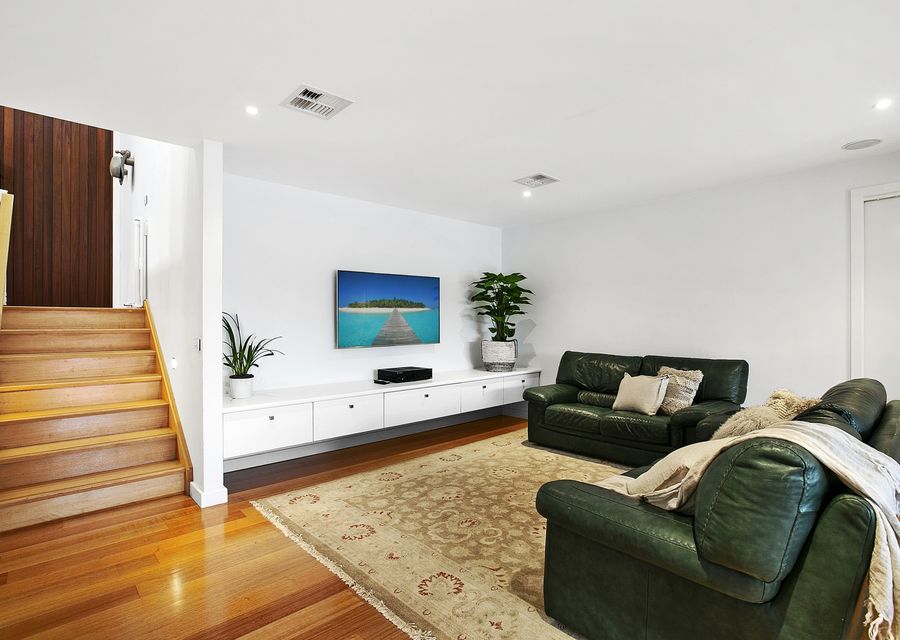 Second living space with a full sized billiard table and smart TV