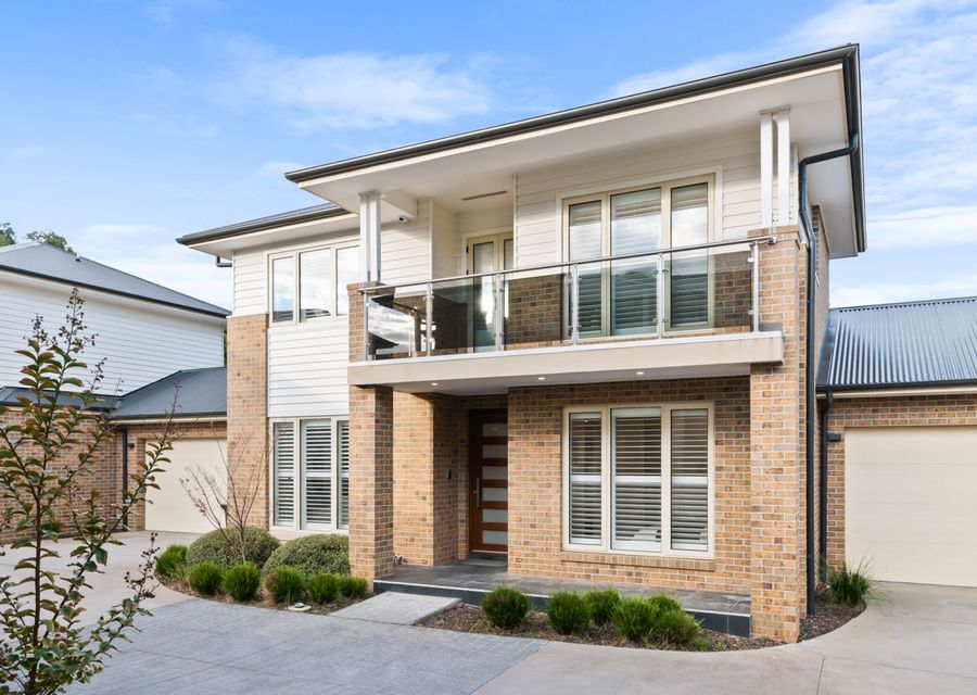 Front fascade with balcony and off street parking