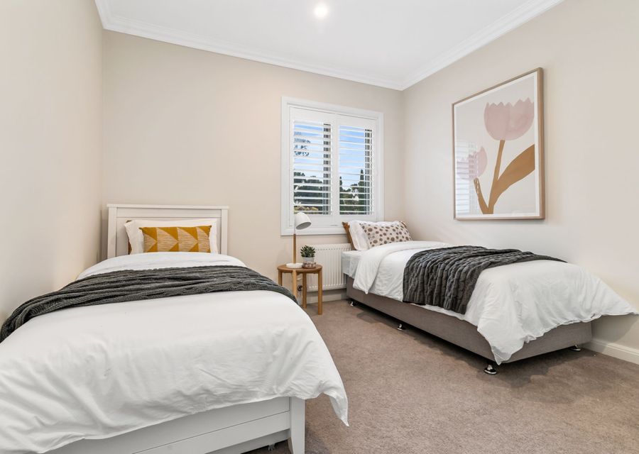 Upstairs bedroom with two singles and a trundle bed 