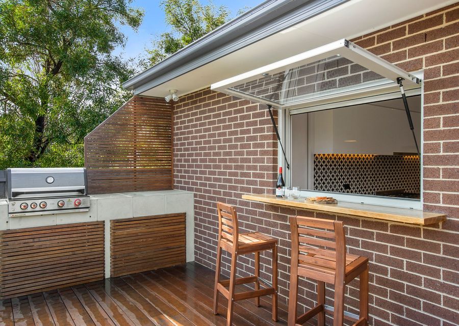 entertaining deck with a built-in barbecue & bar table