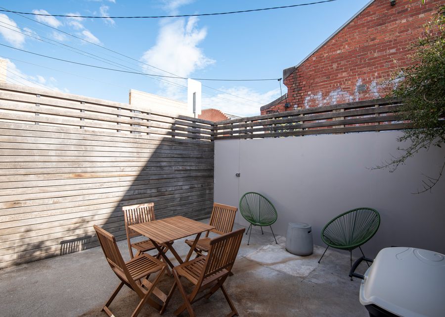 Private courtyard with BBQ and outdoor seating