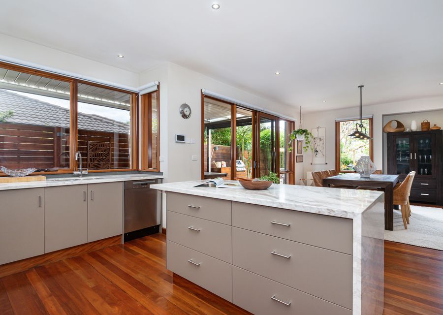 Kitchen - Island Bench looking out onto dining and deck