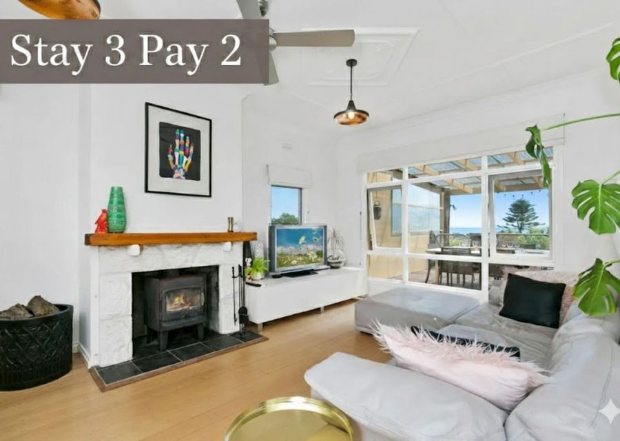 Living area with open fireplace and Smart TV