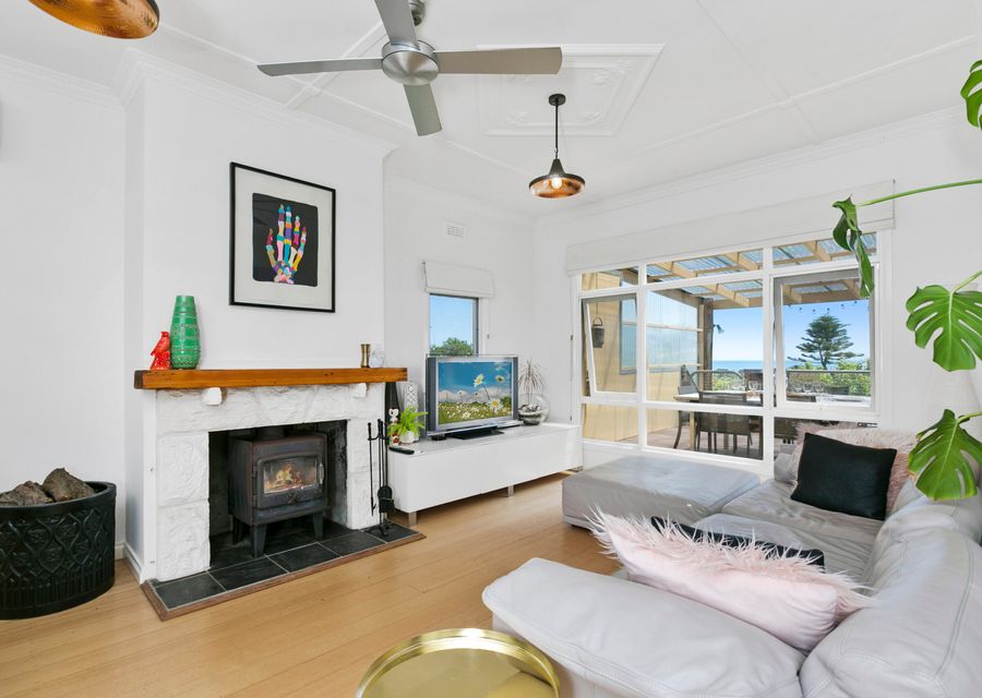 Living area with open fireplace and Smart TV