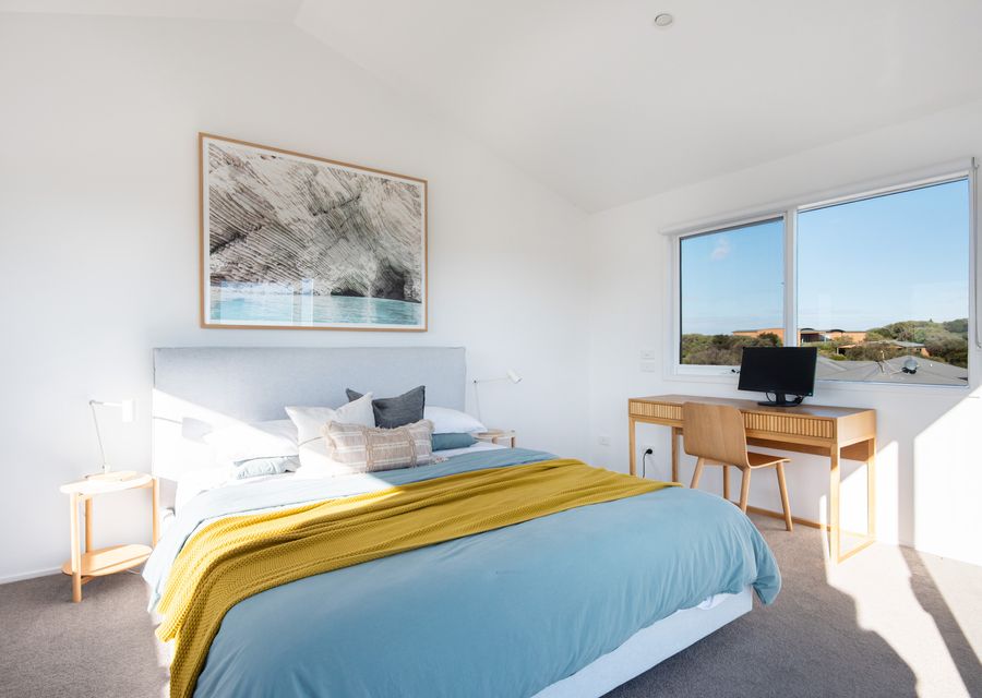 Master bedroom with king bed and dedicated desk space 