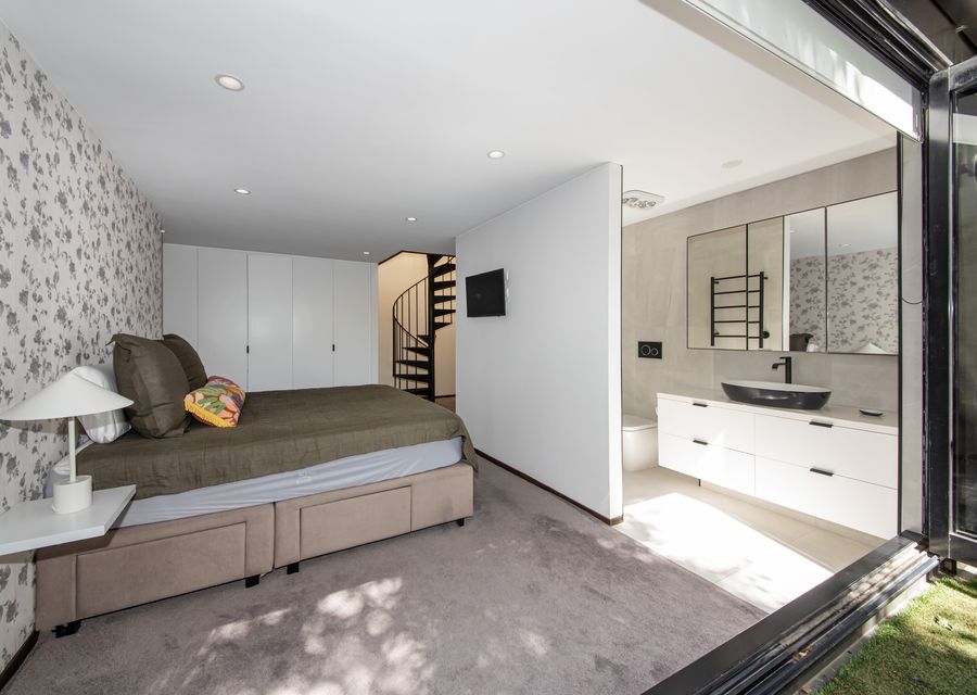 Lower level master bedroom with king bed and ensuite