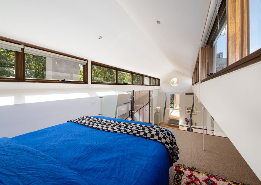 Bedroom three - Loft bedroom with queen bed overlooking dining area