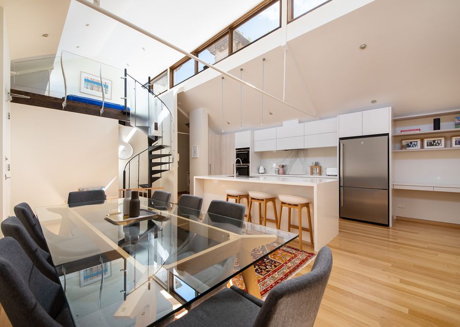 Kitchen and dining with staircase up to the loft bedroom 3