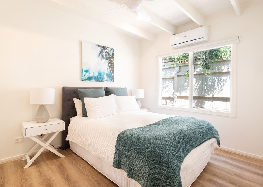 Bedroom 2 also has a queen bed and a split-type air conditioner 