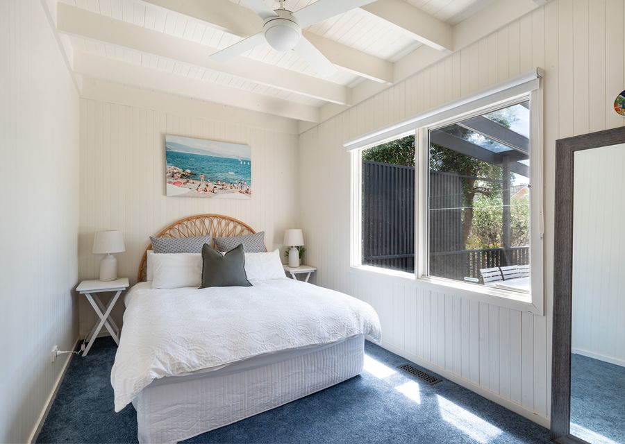 Bedroom 3 has a queen bed and a ceiling fan 
