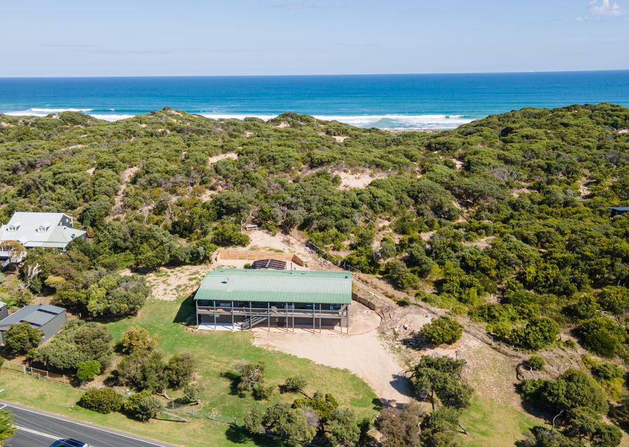 Walk across the sand dunes to the beach 