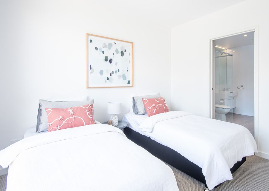 Bedroom Two: Two single beds with ensuite, TV and balcony access