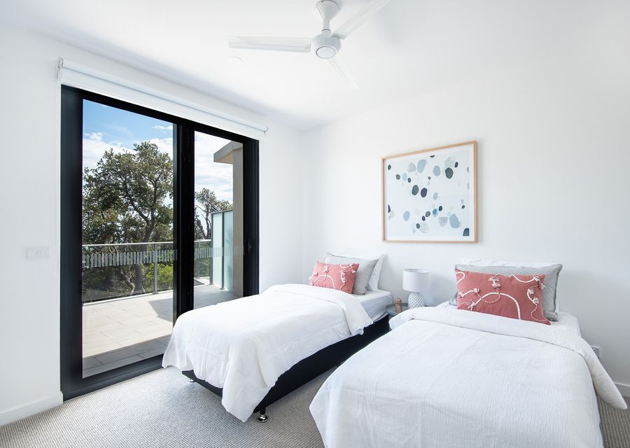 Bedroom Two: Two single beds with ensuite, TV and balcony access