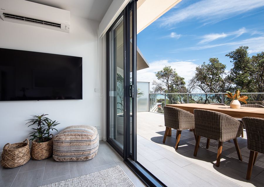 Living room opening out to large outdoor entertainment area