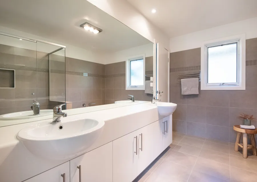 Enormous master bathroom with double vanity, walk in shower and free standing bath tub