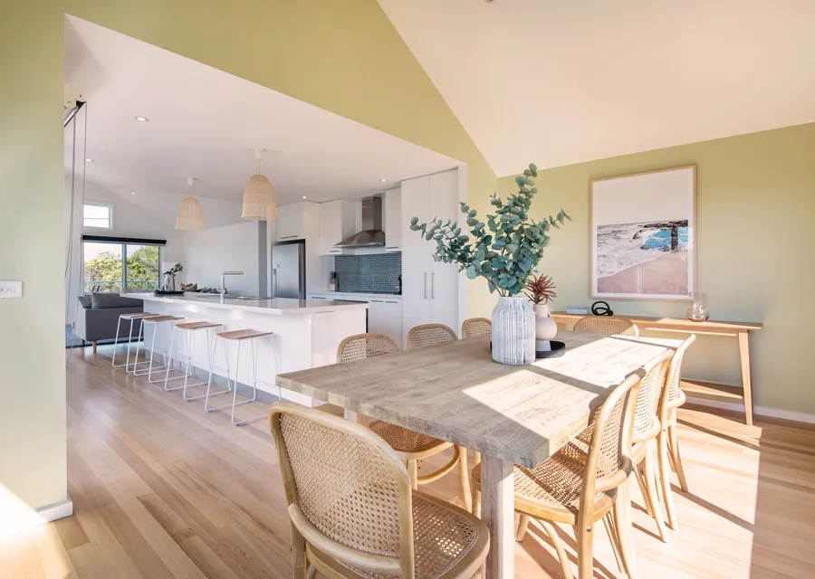 Open plan kitchen with breakfast bar for 4 people and dining for 8 people