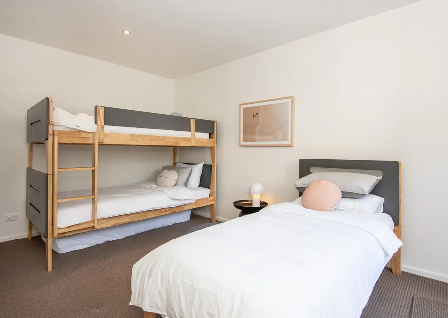 Downstairs bedroom 3 with king single bunk and king single bed and 1 floor mattress