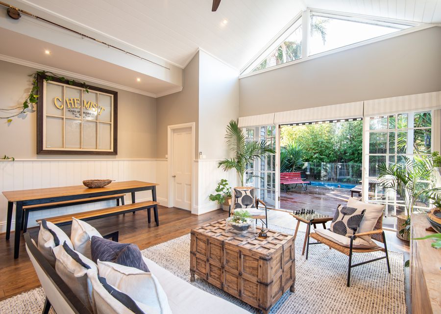 Living and dining leading out to decked back yard and heated plunge pool 